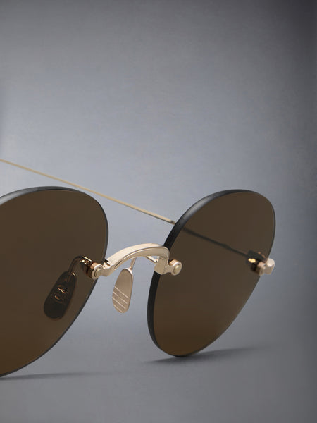 TITANIUM RIMLESS ROUND SUNGLASSES WHITE GOLD