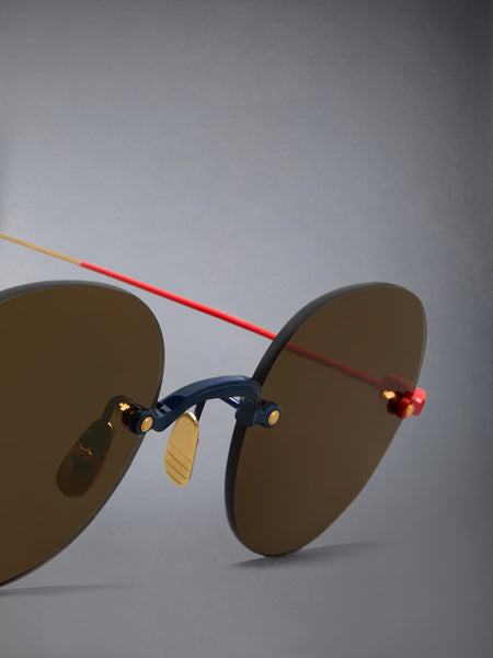 TITANIUM RIMLESS ROUND SUNGLASSES NAVY WITH RED AND WHITE